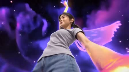 Low, close camera on the dancer as a glowing hand reaches toward the lens